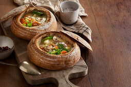 Vegetable soup in a hollowed-out loaf of bread