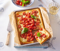 Focaccia with cherry tomatoes, mozzarella and basil