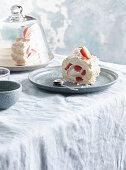 Meringue roll with strawberries and whipped cream