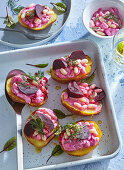Potato halves with beetroot cream, white beans and dill