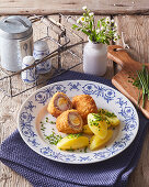 Beef roulades with egg filling and boiled potatoes