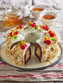 Chocolate wreath cake with vanilla cream filling and fruit