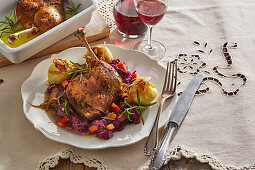 Goose leg with pumpkin and red cabbage and dumplings