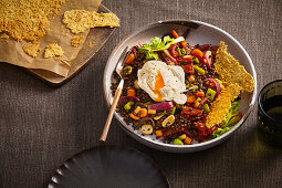 Lentil salad with roasted root vegetables, poached egg and parmesan crisps