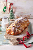Christmas stollen with almonds, candied lemon peel and cranberries