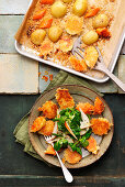 Parmesan potato crusties served with lamb's lettuce and pears