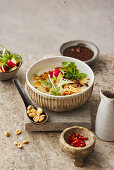 Japanese shiitake congee with rayu, peanuts and coriander