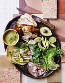 Chicken tacos with avocado, radish and coriander