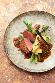 Fillet of beef with open asparagus and leek lasagne