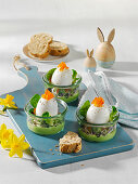 Eggs on chervil cream in a glass with trout caviar