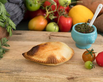 Empanada filled with sweetcorn and chimichurri sauce