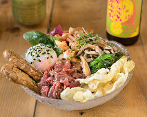 Bibimbap with beef, vegetables, seaweed, mushrooms and egg