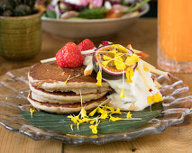 Pancakes with cream, passion fruit and strawberries