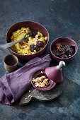 Turmeric barley with plum compote and pistachios