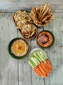 Vegan dips with puff pastry snails, grissini and vegetable sticks