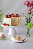 Strawberry cake with vanilla quark cream, macarons and fresh berries