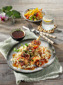 Pork fillet skewers with nectarines and mie noodles