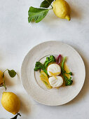 Poached cod with candied lemon and wild broccoli