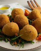 Spanish ham croquettes on a bed of rocket