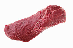 Raw beef tri-tip in one piece on a white background