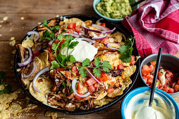 Classic nachos with guacamole and sour cream