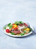Thai beef salad with mango, tomatoes and glass noodles