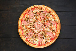 Pizza with beef ham and mushrooms