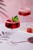 Strawberry cocktail with mint and sugar rim