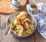 Bread dumplings with bacon, sauerkraut and fried onions
