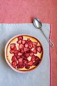 Baked strawberry casserole with vanilla ice cream