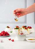 Mini pavlovas with mascarpone, raspberries and passion fruit