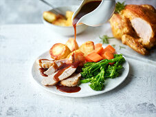 Roast chicken with roast potatoes and vegetables