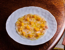 Carpaccio of sea bass with clementines and piment d'Espelette