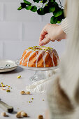 Lemon cake with icing and pistachios