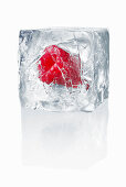 Ice cube with enclosed raspberry