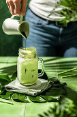 Iced matcha latte with oat drink