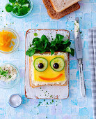 Cheese sandwich for children with cucumber and olives