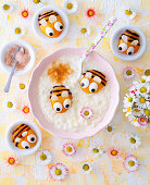 Children's rice pudding with cinnamon-sugar and peach bees