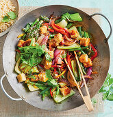 Asian vegetable stir-fry with tofu and sesame seeds