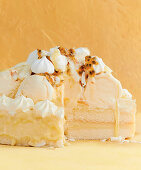 Passion fruit ice cream cake with cream and meringue