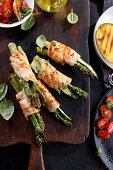 Grilled chicken rolls with green asparagus