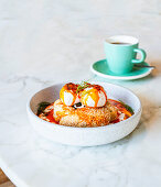 Turkish eggs with yoghurt and simit (Turkish bagel)