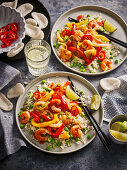 Prawn and vegetable pan with peppers and lime on rice