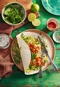 Huevos rancheros with tomatoes and avocado