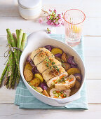 Stuffed chicken roulade with asparagus, carrots and jacket potatoes