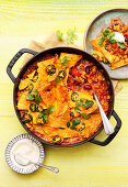 Tex-Mex taco pot au gratin with minced meat and jalapeno