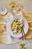 Flower pasta with garlic, olive and orange