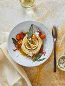 Ravioli rolls with caramelized tomatoes, bacon ricotta and ointment