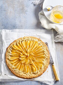 Shortcrust pastry pear galette with apricot jam