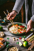 Curry with roasted salmon and rice noodles